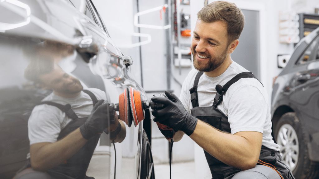 Professional Car Detailing with an Auto Polisher in a Garage