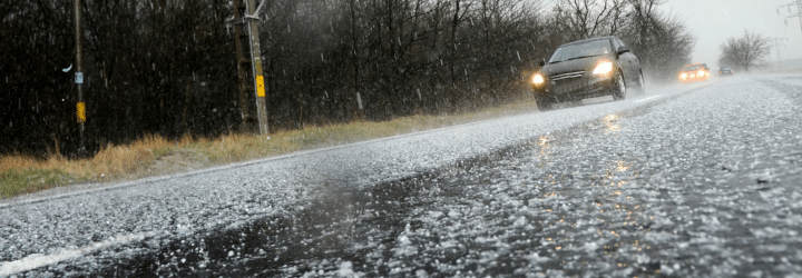 Hailstorm on the road in a summer day