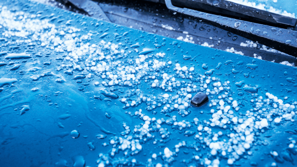 Melting Hailstones on Car Hood - early signs of hail damage